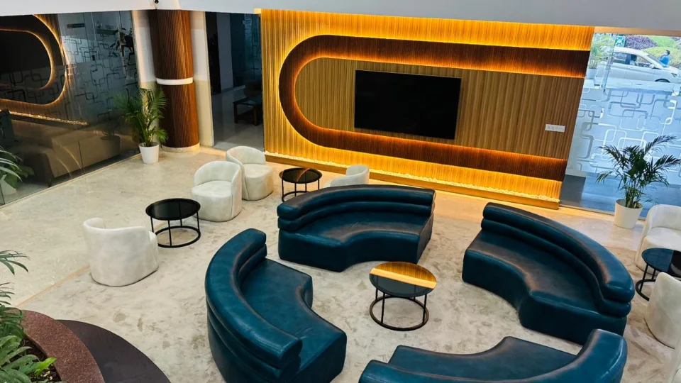 Completed lobby lounge with curved seating and illuminated wall panels