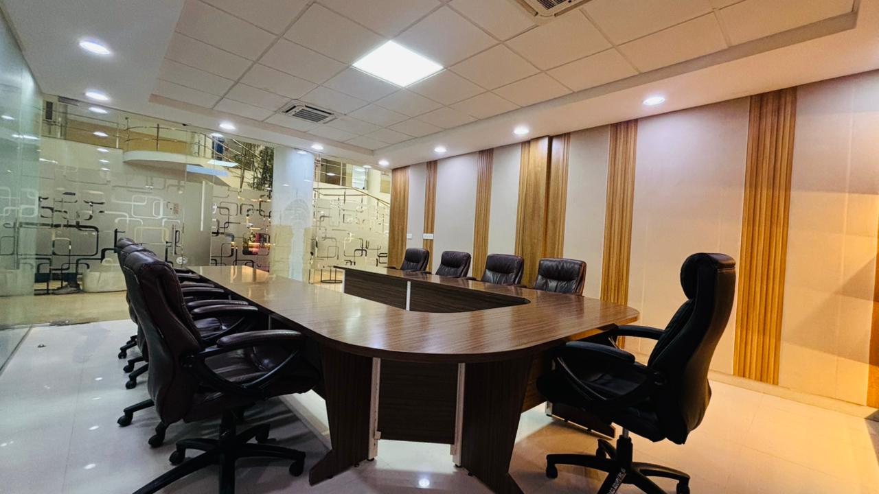 Conference room with wooden meeting table and glass partitions