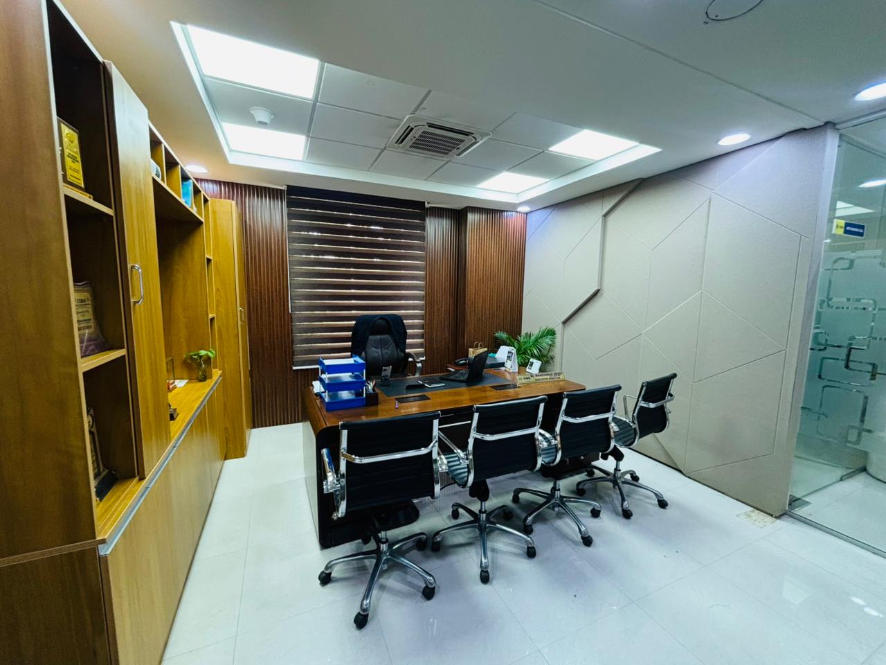 Executive office cabin with wood storage and desk seating