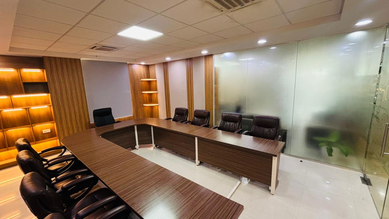 Conference room with U-shaped wooden meeting table
