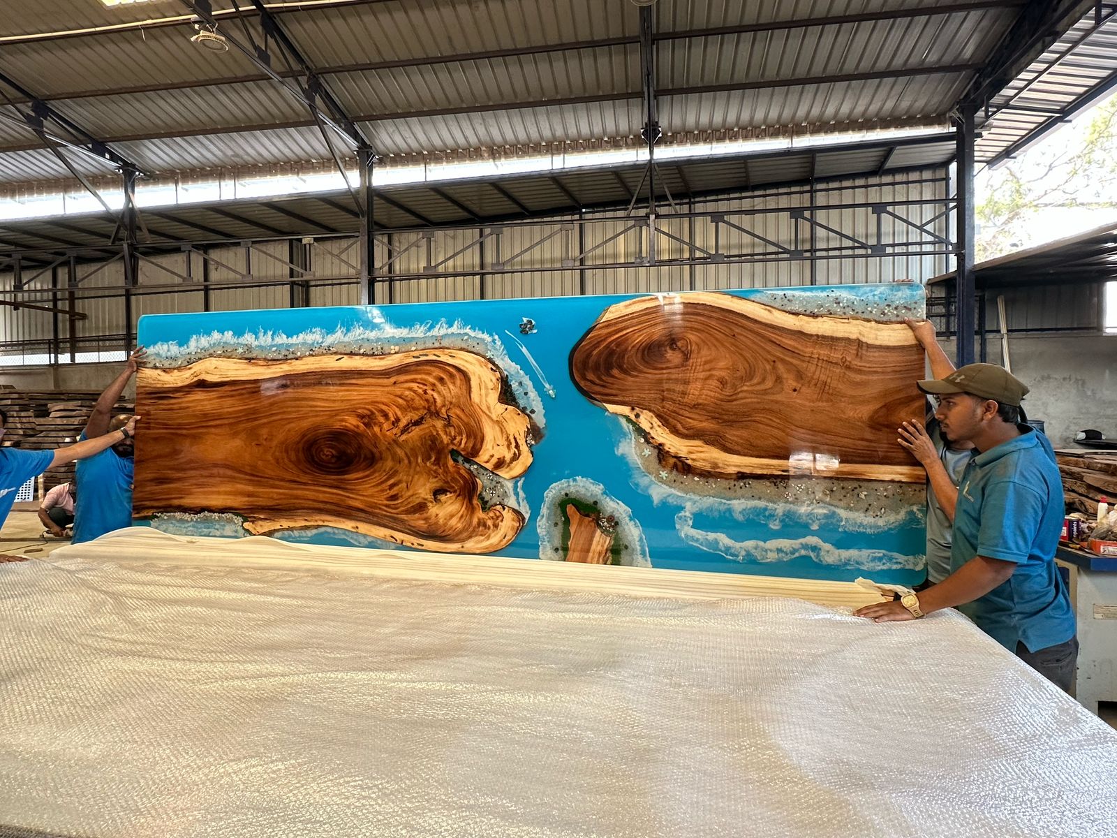Custom resin and wood feature panel under production
