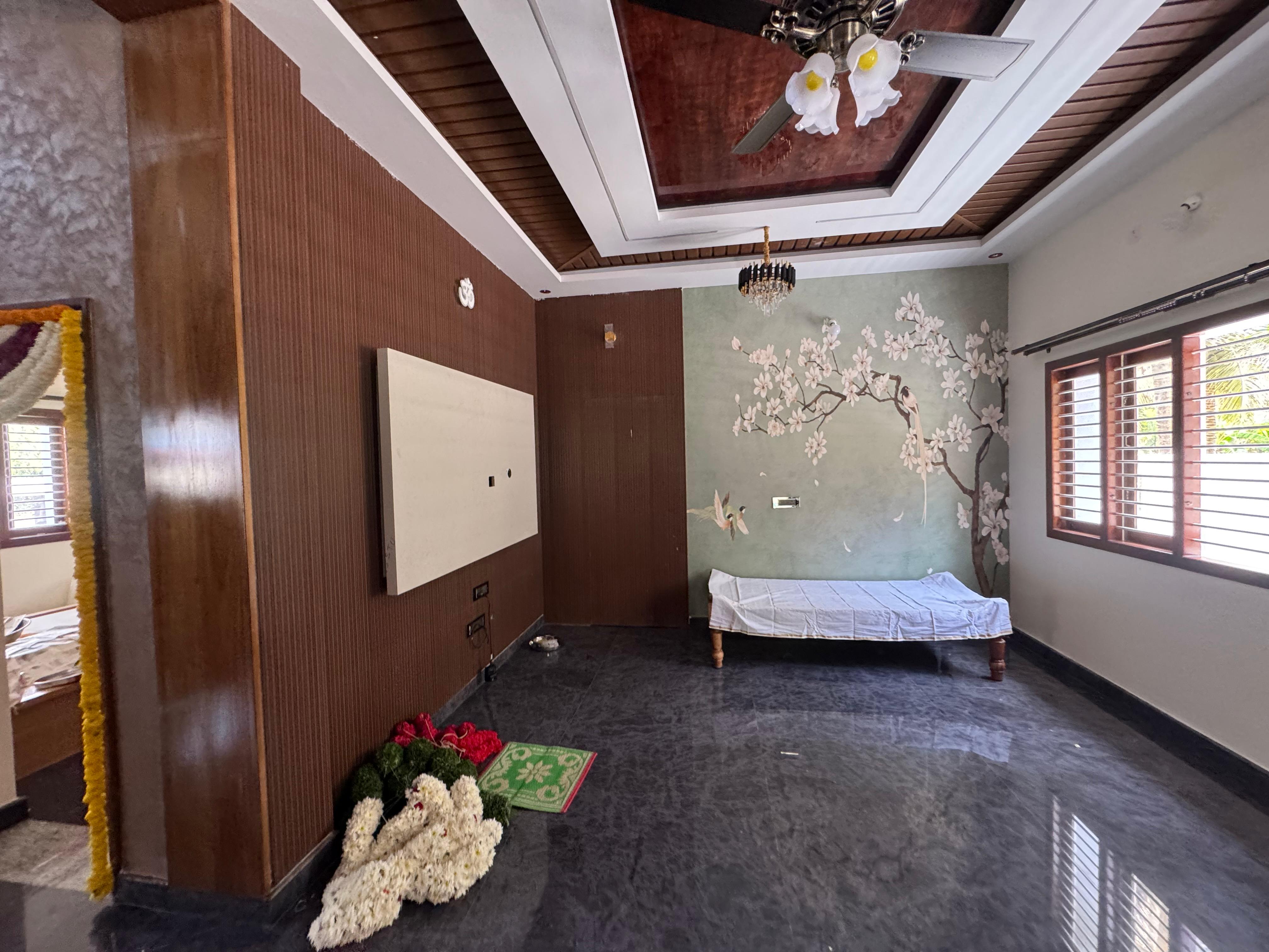 Living room with wood paneling, TV unit, and decorative wall art