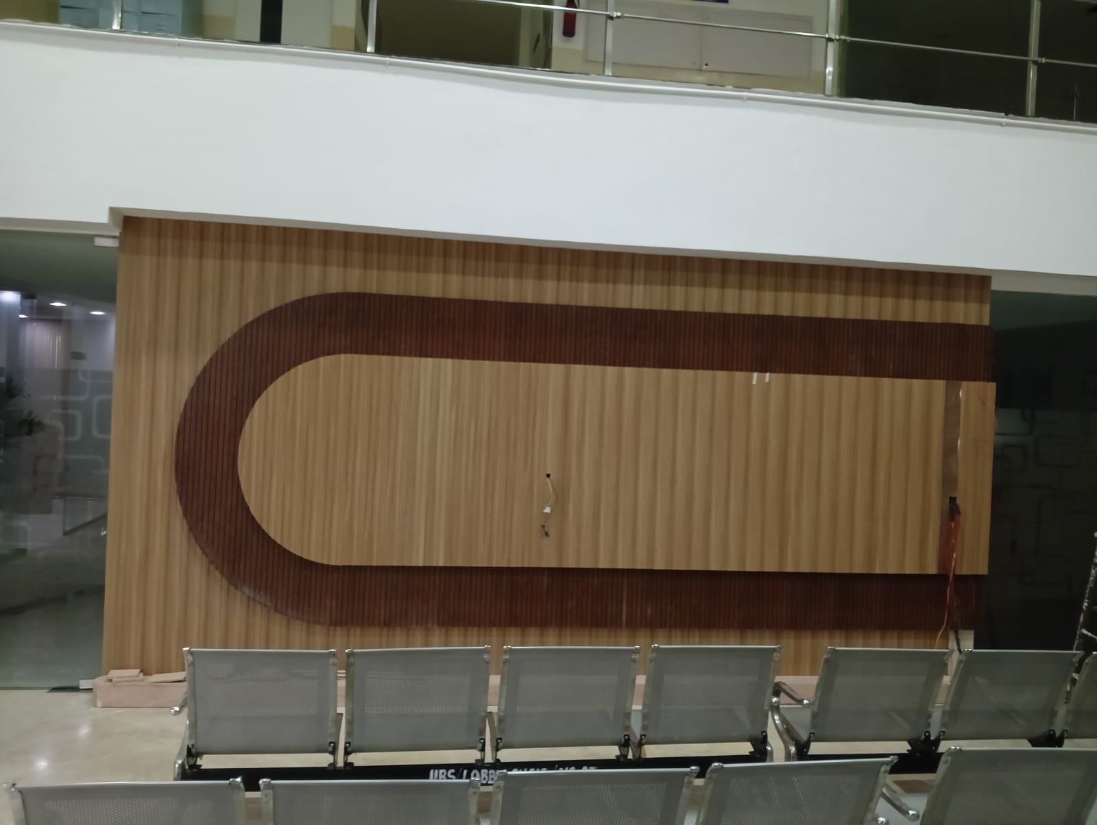 Plain reception wall before lobby lounge transformation